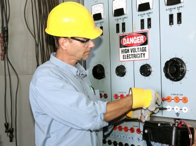 McGowan & PLD LLC industrial electrician working with high voltage.